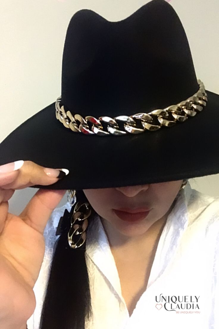 The very stunning Dakota Chain Band Hat is the perfect classy, trending and an absolute must have! The unique curb gold chain accent cowboy hat will surely turn heads! Adding this one-size hat to any outfit can give it just the kind of kick it may need! The chain above the brim adds a special and stylish touch. The soft wool material is desirable without any uncomfortable itch. Pair with a flowy dress, sandals and sunglasses in the summer. Accessorize with over the knee boots and a cardigan for