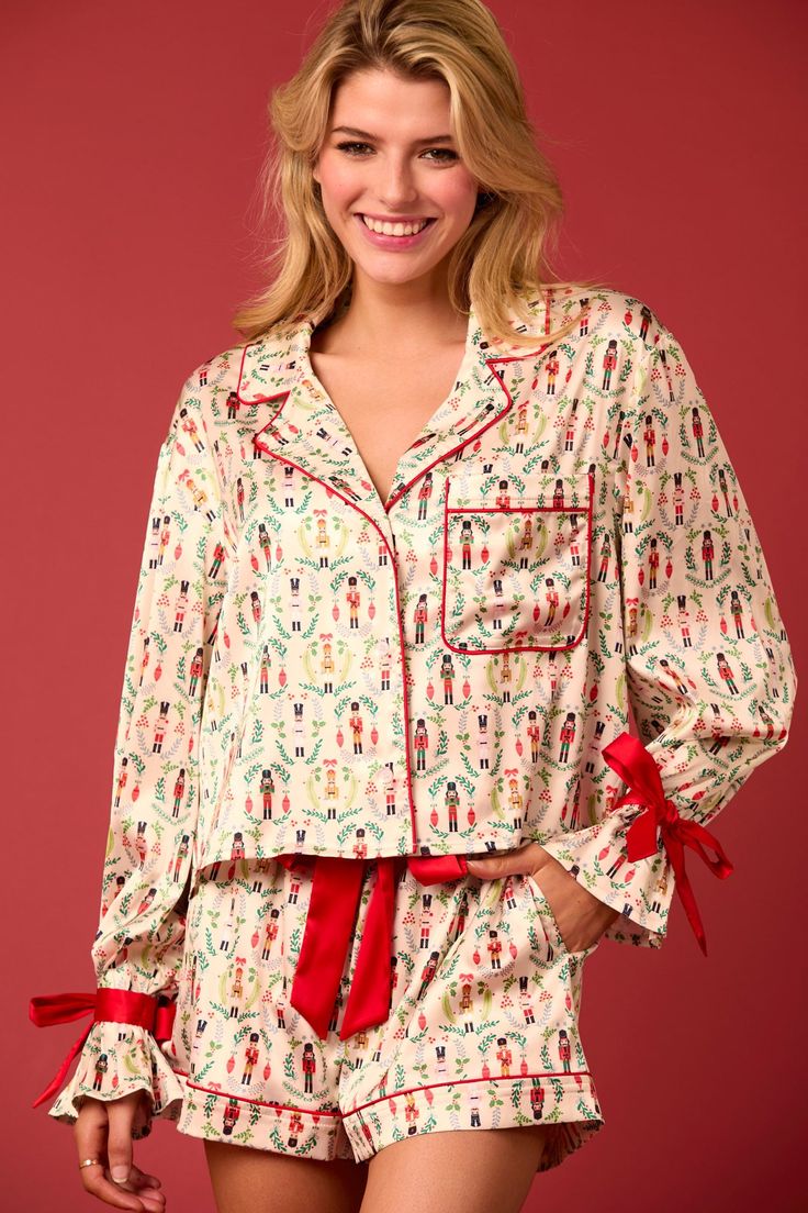 toy solider pattern bow sleeve detail satin pj set with red detailing Luxurious Pajamas, Sorority Dresses, Christmas Toy Soldiers, Twas The Night Before Christmas, Satin Pj Set, Shirt Collar Styles, Satin Pajama, Cuffed Top, Christmas Pajama Set