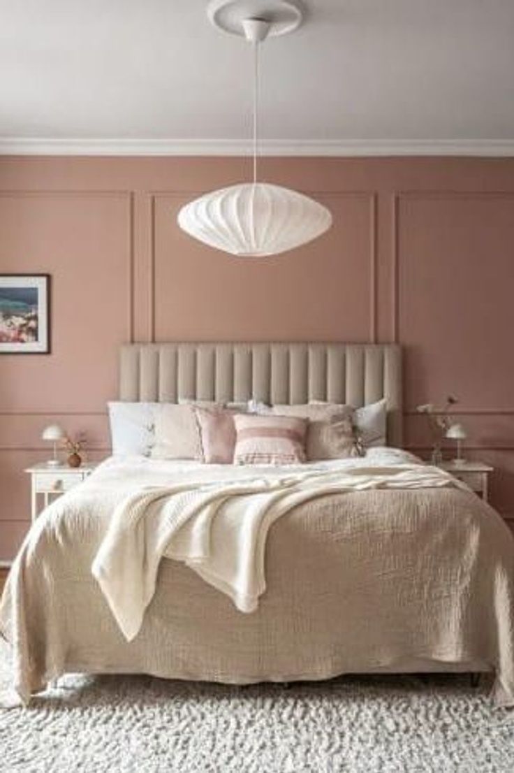 A bedroom with a dusty pink wallcolor and bedroom wainscoting to accentuate the bold color choice Champagne Pink Bedroom, Dusty Rose Pink Bedroom, Dusty Pink Ceiling, Bedroom Coloured Wall, Dusty Pink Wall Color, Pink Panelled Bedroom, Bedroom Pink Ideas, Dusk Pink Bedroom, Dusty Rose Girls Bedroom