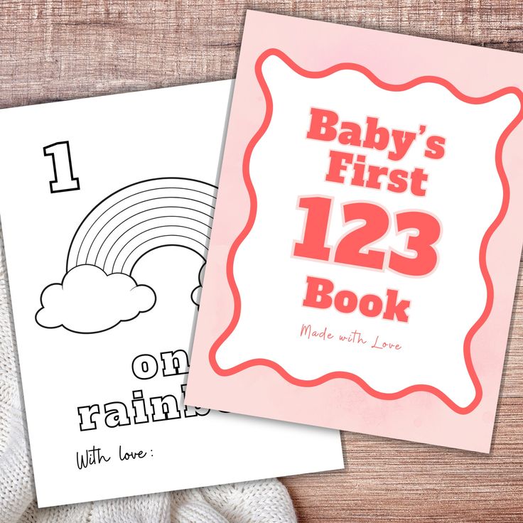 baby's first 123 book with love and rainbow on it, next to an adult coloring book