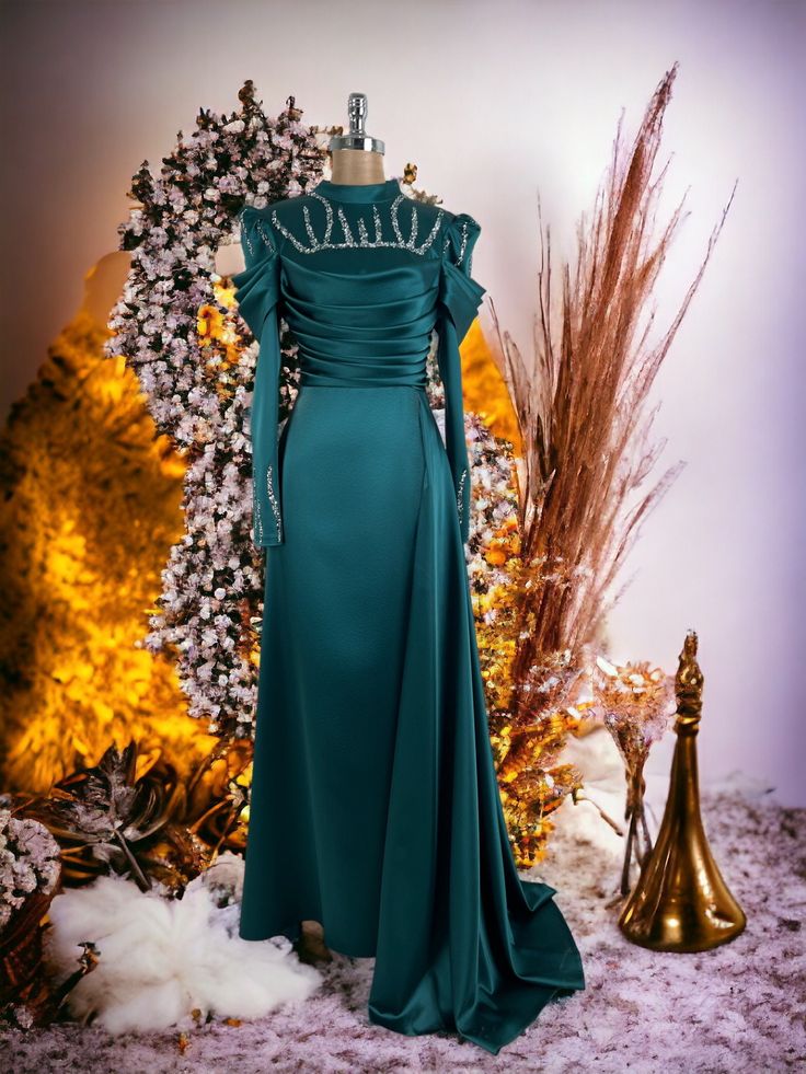 It is made of 100% satin fabric.  It weighs 900 grams.  It is a lined dress.  The length of the product is 155 cm.  Measurements for size 38 are 92 cm bust, 76 cm waist, 94 cm hips. Floor-length Evening Gown For Eid, Eid Evening Floor-length Gown, Eid Evening Gown With Sequins, Elegant Evening Maxi Dress For Eid, Sequin Satin Dress For Banquet, Elegant Long Dress Abaya For Party, Elegant Maxi Dress For Eid Party, Formal Maxi Evening Dress For Eid, Elegant Eid Party Maxi Dress