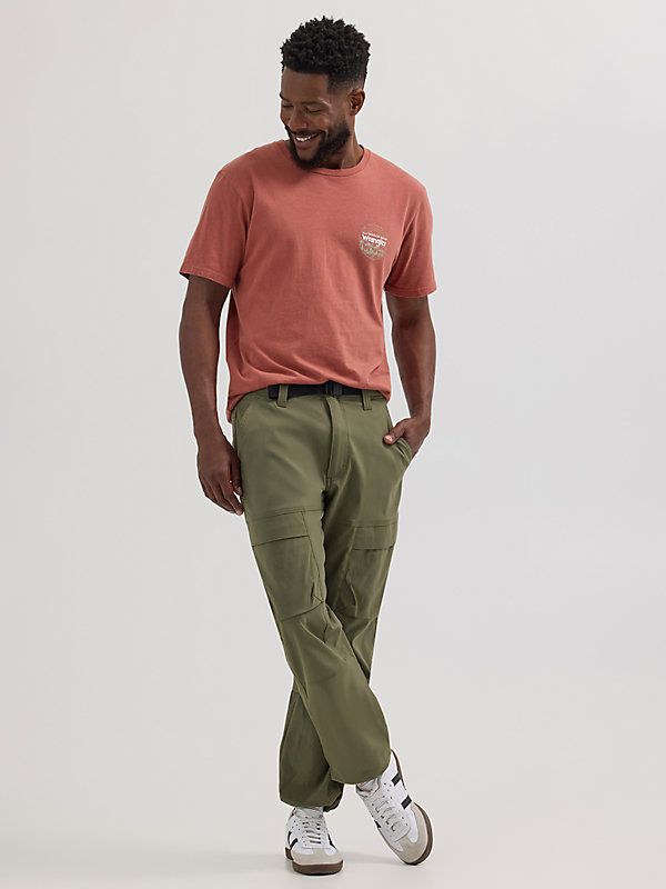 When you’ve got places to be, the ATG by Wrangler® Men’s Relaxed Cargo Pant will get you there in comfort. It’s crafted from a durable performance fabric blend with two-way stretch to give you more freedom, built-in UV protection from the sun, and a water-repellent finish so you stay dry if the forecast has other plans. These better-than-classic cargo pants feature a relaxed fit, a drawcord at the leg opening to convert your look on the fly, a belted waist, and pockets for all your essentials. Jogger Outfits, Wrangler Pants, Places To Be, Men's Pants, Cargo Pant, Cargo Pants Men, The Fly, Performance Fabric, Cargo Pants