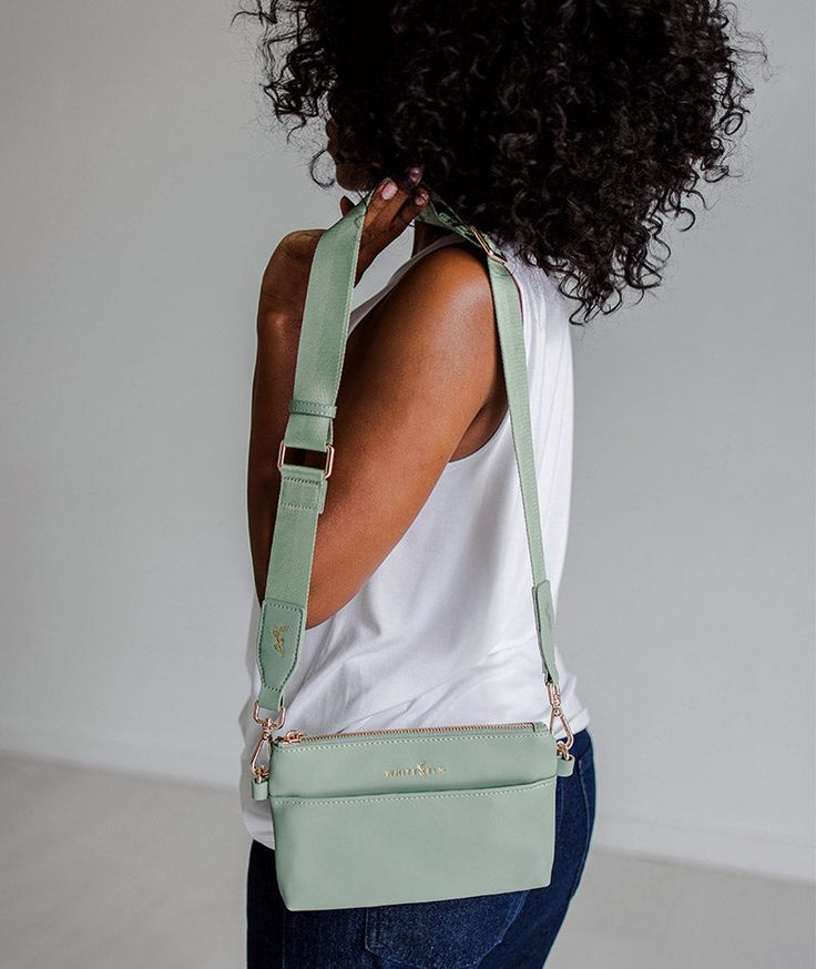 *Limited Edition Color* The Skye sling bag is our much-anticipated crossbody that holds everything you need while you're on the go! It has a built-in wallet with three card slots, two open pockets for extra cards or gum, and a cash slot to stash your bills. On the front, you'll find a zippered pocket where you can store receipts, spare change, or other small items, and a pocket with a magnetic snap closure on the back perfect for keeping your phone safe & sound. Snap on the adjustable nylon stra Store Receipts, Spare Change, Cute Wallets, Large Wallet, Backpacking Packing, Guitar Strap, Wallet Bag, Great Christmas Gifts, Large Bag