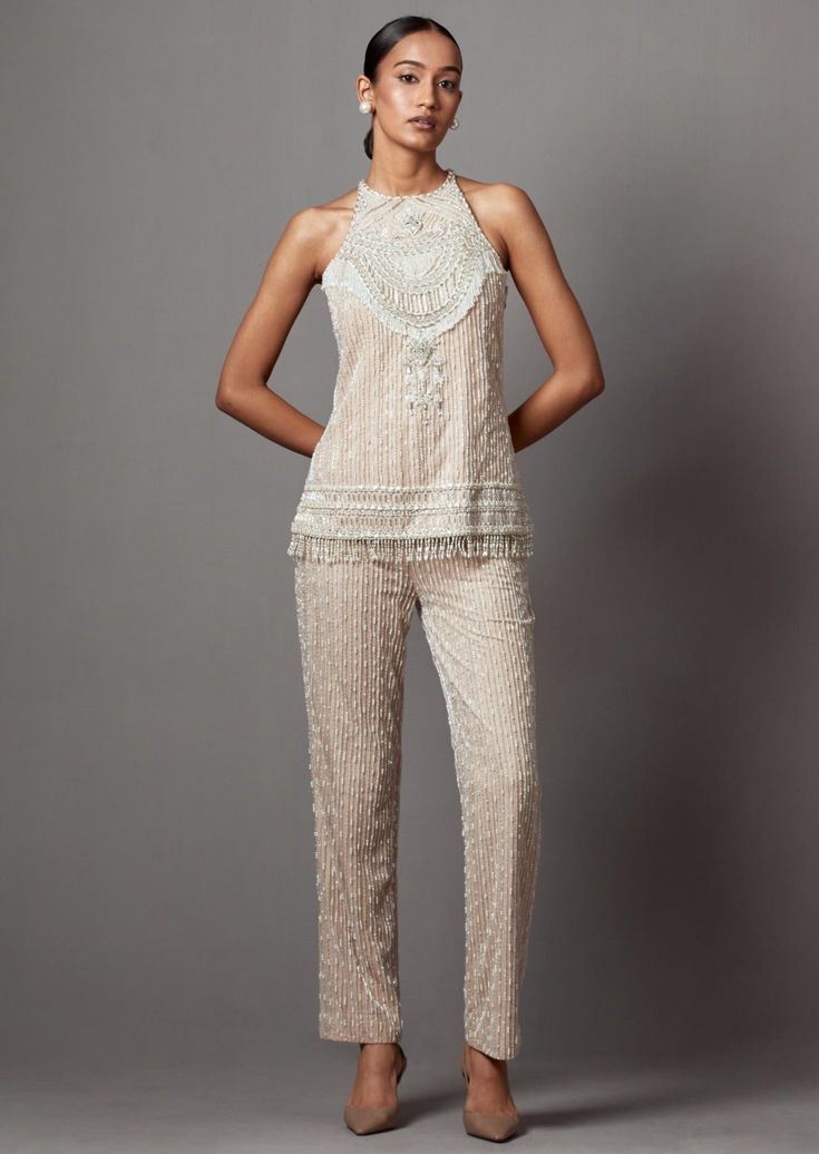 Hand embroidered statement hi-shine co-ord pant top set. Elegant Embellished Summer Pants, Elegant Embellished Bottoms For Festive Occasions, Glamorous Embellished Bottoms For Wedding, Elegant Festive Embellished Bottoms, Chic Embellished Bottoms For Wedding, Chic Embellished Wedding Bottoms, Glamorous Embellished Pants For Wedding, Sleeveless Fitted Sets With Pearl Embroidery, Fitted Sleeveless Sets With Pearl Embroidery