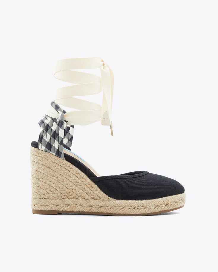 Summer in a shoe. The Olivia Espadrille Wedges feature a walkable braided-jutewedge and platform andnon-slip rubber sole. Perfect with knee-length and midi dresses or ankle-bearing jeans, the Olivia espadrille wedge is a comfortable walking height with a twill ankle tie and a hint of gingham check at the heel.========Canvas ; Espadrille Wedge; Ankle wrap with tassel detail; Memory foam sock padding; 3.5in heel; Imported; FO0079; Casual Lace-up Wedge Sandals With Woven Sole, Casual Summer Wedge Sandals With Reinforced Heel, Casual Summer Heels With Reinforced Heel, Casual Heels With Textured Sole, Casual Lace-up Wedge Sandals With Removable Insole, Casual Heels With Woven Sole, Casual Platform Heels In Espadrille, Black Wedge Sandals With Rubber Sole For Spring, Casual Wedge Sandals With Wrapped Heel For Spring