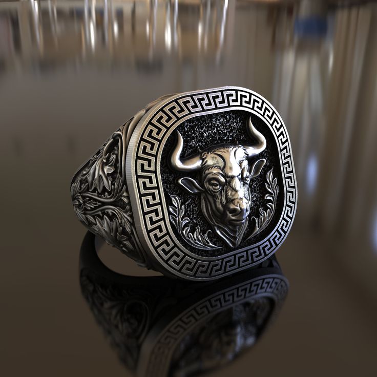 Introducing our meticulously handcrafted Bull Ring Greek Ornament Themed 925 Sterling Silver Ring. This unique piece of jewelry is a tribute to the rich mythology and art of ancient Greece, making it an ideal gift for history lovers, art enthusiasts, or anyone who appreciates unique designs. The ring is made from 925 sterling silver, known for its durability and timeless appeal. It features a detailed bull and Greek ornament, symbols of strength and beauty, making it a conversation starter where Symbolic Carved White Gold Jewelry, Ceremonial Sterling Silver Rings With Polished Finish, Sterling Silver Rings With Polished Finish For Ceremonial Occasions, Sterling Silver Rings With Polished Finish For Ceremonies, Symbolic Carved Sterling Silver Signet Ring, Silver Oxidized Finish Signet Ring As Gift, Carved White Gold Ring, Artisan Carved Sterling Silver Jewelry, Symbolic Carved Sterling Silver Rings