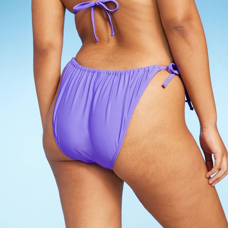 Scoop-front bikini bottom from Wild Fable™ in a solid hue. Made from soft fabric with spandex and full lining for flexible comfort in and out of the water. Tailored in a low-rise, high-leg silhouette. Side string ties complete the look with a customizable fit and coverage. If you’re not satisfied with any Target Owned Brand item, return it within one year with a receipt for an exchange or a refund. Wild Fable™: A look for every story. Stretch Tankini With Tie-side Bottom For Sunbathing, Beach Season Tankini With Tie-side Bottom, Solid Swimwear With Drawstring For Beach Season, Solid Color Swimwear With Drawstring For Beach Season, Nylon Tankini With Tie-side Bottom For Sunbathing, Nylon Tankini For Sunbathing With Tie-side Bottom, Nylon Tie-side Tankini For Sunbathing, Solid Seamless Tie-side Swimwear Bottom, Solid Color Seamless Swimwear With Tie-side Bottom