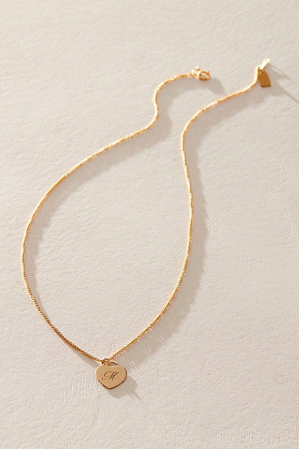 Just as effortless as it is elegant, this stunning necklace features a heart-shaped pendant with gorgeous cursive engraved initial for the ideal finishing touch. * 14k Gold Filled wheat chain * Personalized, laser engraved, 14k Gold Filled 12x14mm heart charm * Length: 18" * 5 days of production | Set & Stones Personalized Alice Necklace at Free People in Gold Gold Heart Necklace As Personalized Gift, Gold Charm Necklace With Heart Initial Pendant, Elegant Heart Pendant Charm Necklace For Personalized Gift, Elegant Personalized Heart Pendant Charm Necklace, Elegant Engraved Heart Necklace For Personalized Gift, Classic Heart Pendant Necklace With Initials, Elegant Name Necklace With Heart Charm As Personalized Gift, Elegant Personalized Name Necklace With Heart Charm, Classic Initials Heart Pendant Necklace