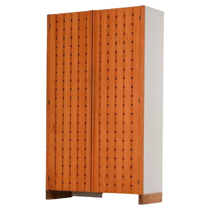 an orange and white wooden cabinet with holes on the front, against a white background