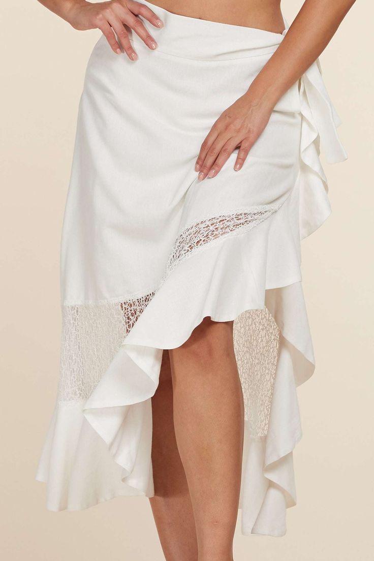 This elegant two-piece ensemble is crafted with a classic design, featuring a puff-sleeved crop top adorned with an oval brooch and a midi skirt with mesh paneling at the sides for an elevated finish. Ruffled trim adds a chic final touch. Self : 70% Linen 30% Cotton Contrast : 70% Cotton 30% Nylon Lining : 100% Cotton Top: exposed silver back zipper, self-tie bow in back Model is wearing size Small Elegant Lined Skirt For Brunch, Chic Asymmetrical Skirt With Lace Trim, Elegant Maxi Skirt For Brunch, Elegant Midi Skirt For Brunch, Chic Lace Trim Maxi Skirt For Summer, Chic Spring Maxi Skirt With Lace Trim, Elegant Maxi Skirt For Spring Beach Outings, Elegant Summer Maxi Skirt For Brunch, Elegant Spring Maxi Skirt For Beach