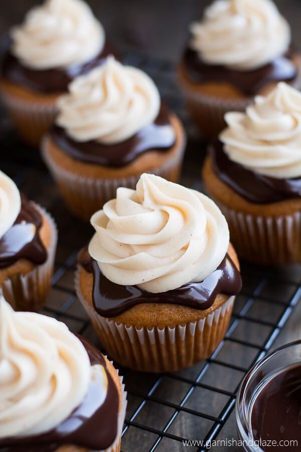 cupcakes with white frosting and chocolate sauce