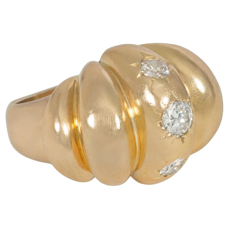 A Mid-Century gold and diamond bombé cocktail ring of lobed design, centered by three round brilliant-cut in-set diamonds, in 18k. France. Atw 0.75 ct. Face-up north to south measurement: 0.75" * Please do not hesitate to contact Kentshire with requests for photos of specific details or of this timeless ring on a live model. Live Model, Timeless Ring, Domed Ring, Cocktail Ring, Cocktail Rings, Round Brilliant, Gold Diamond, Jewelry Rings, Diamonds