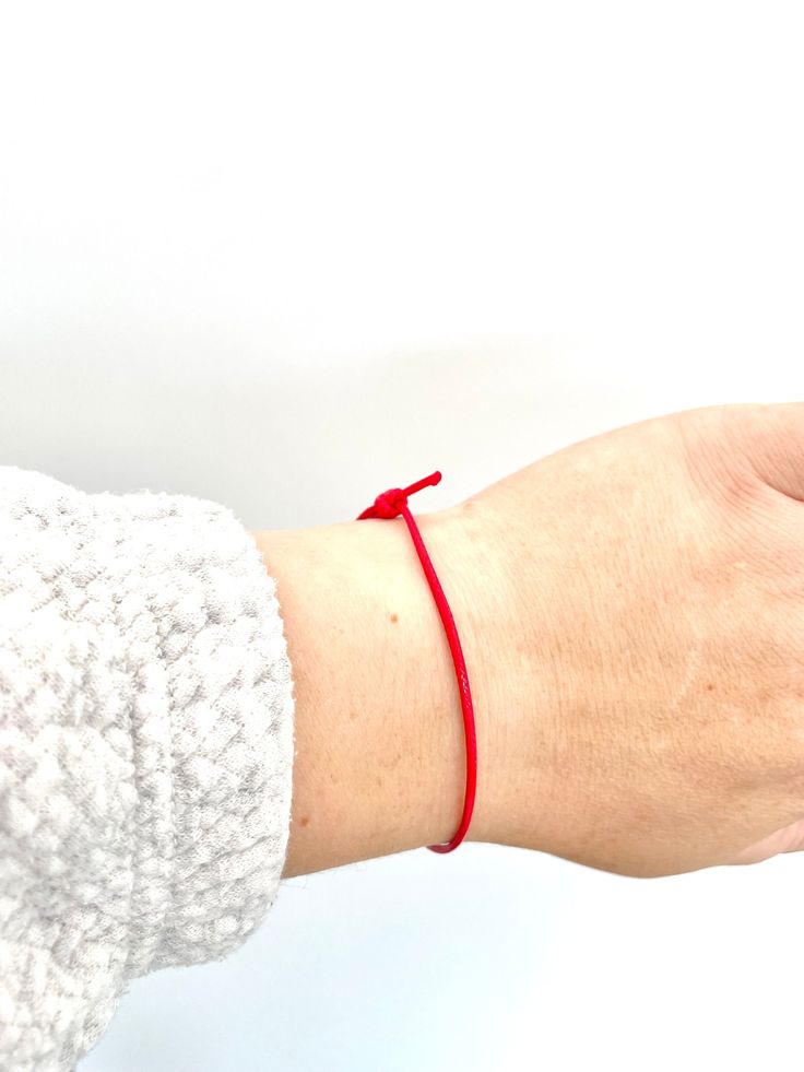 2 x Red String Bracelets, Red Protection Bracelet, Simple Cord Wish Bracelet, Protection Jewellery, Kabbalah Bracelet, Red Good Luck String 🌟 Features 🌟 Vibrant Red: Our bracelets feature a vibrant red waxed cotton cord that adds a pop of color to any outfit. Durable & Adjustable: The waxed cotton cord not only looks fantastic but is also durable, ensuring that your bracelets will withstand daily wear. Plus, they are adjustable to comfortably fit most wrist sizes. Versatile Style: These bracelets are versatile and can be worn individually or layered with other jewelry for a trendy, boho-chic look. Handcrafted with Care: I have carefully handcrafted each bracelet, ensuring they meet Feel And Believe high-quality standards. 🎁 Perfect Gift 🎁 These Red Waxed Cotton Cord Bracelets make a fa Red Braided Bracelets For Valentine's Day, Red Bracelet With Sliding Knot For Valentine's Day, Red Sliding Knot Bracelet For Valentine's Day, Red Braided Bracelet With Sliding Knot For Friendship, Red Braided Friendship Bracelet With Sliding Knot, Red Bangle Bracelet With Strap, Adjustable Red Braided Bracelet Gift, Red Bangle Jewelry For Friendship, Red Bangle For Friendship