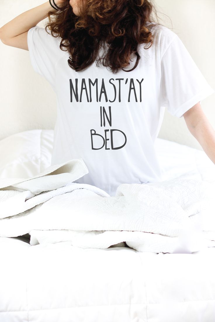 Namastay In Bed Whether you are looking for fun yoga shirts like this one or some soulful vibed tops- this is your go to shop! ArimaDesigns.com White Crew Neck Top For Relaxation, White Letter Print Sleep Tops, Short Sleeve Tops With Letter Print For Sleep, Short Sleeve Letter Print Sleep Top, Short Sleeve Sleep Top With Letter Print, Cotton Graphic Print Tops For Lounging, Relaxation Graphic Print Crew Neck Top, Graphic Print Crew Neck Tops For Relaxation, Crew Neck Top With Graphic Print For Relaxation