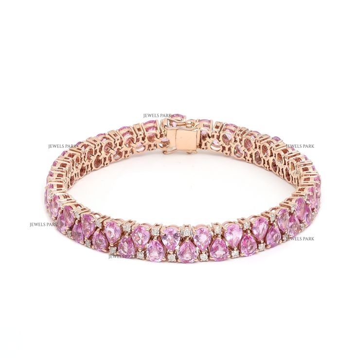 Pink sapphire emerald cut tennis bracelet in gold | Pink sapphire diamond bracelet | Emerald cut pink sapphire bracelet | Sapphire bracelet STONE DETAILS : ✦ Gemstone : Pink Sapphire ✦ Gemstone Type : Natural ✦ Gemstone Size : 5x3 MM ✦ Gemstone Shape : Princess Cut ✦ Gemstone Weight : 12 carats ✦ Gemstone Grade : AAAA DIAMOND DETAILS : ✦ Diamond Type : Natural ✦ Diamond Size : 1.20 mm ✦ Diamond Color : F-G ✦ Diamond Clarity : Slightly included ✦ Diamond Cut : Excellent - Very Good ✦ Diamond Weight :2.5-3 Carats METAL DETAILS : ✦ Metal : 14K/18K Gold ✦ Metal Color : Yellow / White / Rose Gold ✦ Setting : Prong Setting ✦ Ring Box : Yes SHIPPING DETAILS : ✦ Shipped via : USPS ✦ Production time : 10-12 days ✦ Delivery time : 7-8 days ✦ Expedited shipping : Available ✦ Expedited shipping servic Pink Pear-shaped Diamond Jewelry, Pink Pear-shaped Gemstone Jewelry, Fine Jewelry Pink Sapphire Round Cut, Oval Pink Sapphire Jewelry With Diamond Accents, Pink Gold Cubic Zirconia Jewelry With Prong Setting, Rose Gold Diamond Bracelets With Gemstones, Luxury Pink Sapphire Diamond-cut Jewelry, Luxury Pink Sapphire Jewelry With Diamond Cut, Pink Diamond Gemstone Bracelets