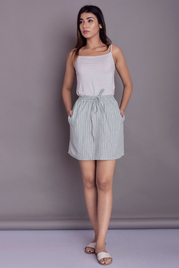 "Mini linen skirt, Skirt with Pockets, Elastic waistband with drawstring, Yarn dyed Skirt, Stripe skirt - Custom made by Modernmoveboutique This skirt is available in 2 types of fabrics :- - Solid - denoted by (S) - Yarn Dyed - denoted by (YD) >DESCRIPTION< - Length of the skirt - 17\" (43 cm) - If you want to customize the length, please mention in 'Note to seller' section while ordering the skirt. - made from Yarn dyed Linen blend. The fabric is of medium weight (185 g). - the model is 1 Casual Skirted Bottoms With Banded Waist, Summer Flared Skirt With Gathered Waist, Relaxed Drawstring Skirt, Summer Relaxed Tie Waist Skirt, Summer Skirt With Tie Waist And Relaxed Fit, Summer Relaxed Skirt With Tie Waist, Casual Skirt With Elastic Waistband For Daywear, Summer Long Skirt With Gathered Waist, Flowy Tie Waist Skirt For Daywear