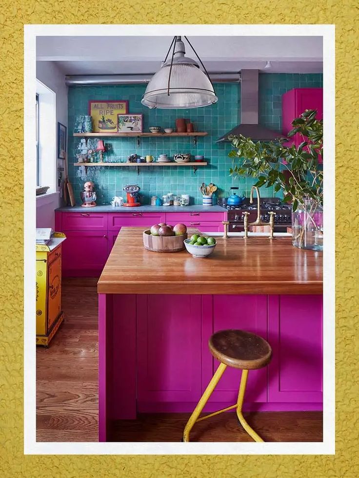 an image of a kitchen setting with purple and green colors on the walls, wood countertops and stools