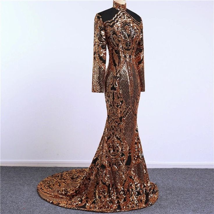 Stunning piece of embroidery, thousands of orangy gold sequins embroidered on black tulle to form this intricate design. This fabric is suitable for a stunning outfit to impress. Width is 140cm. Price is for one meter. Orders over one meter will be a continuous length of fabric. Gold Sequin Dress With Contrast Detail For Wedding, Black Fitted Sequin Dress For Wedding, Black Glamorous Sequin Fabric For Formal Events, Black Glamorous Sequin Fabric For Formal Occasions, Glamorous Black Sequin Fabric For Formal Occasions, Elegant Black Sequin Fabric With Contrast Sequin, Glamorous Black Sequin Fabric With Glitter, Gold Sequin Evening Dress For Prom, Glamorous Black Glitter Sequin Fabric