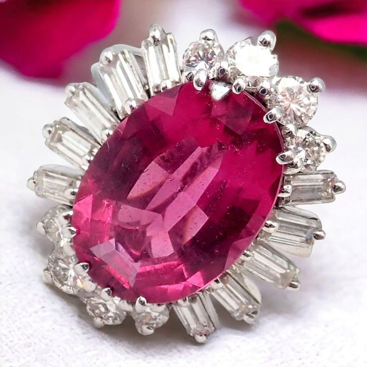 This H. Stern jewelry set, elegantly crafted from 18k white gold, exudes luxury and sophistication. The centerpiece of the set is the ring, featuring a stunning pink tourmaline, known for its captivating hue. This gemstone is beautifully accented with an array of brilliant diamonds that encircle it, enhancing its radiance. Complementing the ring are a pair of earrings, designed in harmony with the ring. These earrings also showcase pink tourmalines, each surrounded by sparkling diamonds, creatin Luxury Pink Ruby Ring In Platinum, Pink Ruby Ring In Platinum, Luxury Pink Ruby Ring For Formal Occasions, Pink Platinum Ring With Gemstone, Pink Platinum Ruby Ring, Pink Platinum Gemstone Ring, Pink Platinum Rings With Gemstones, Pink Platinum Ruby Ring For Wedding, Luxury Tourmaline Jewelry With Prong Setting