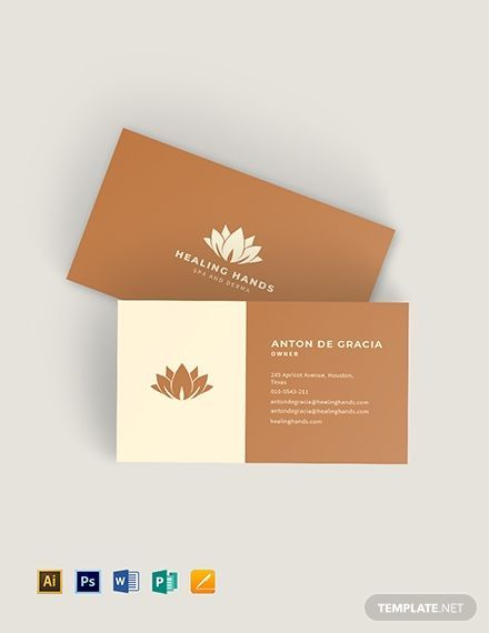 a brown and white business card with a lotus symbol on the front, sitting on top of