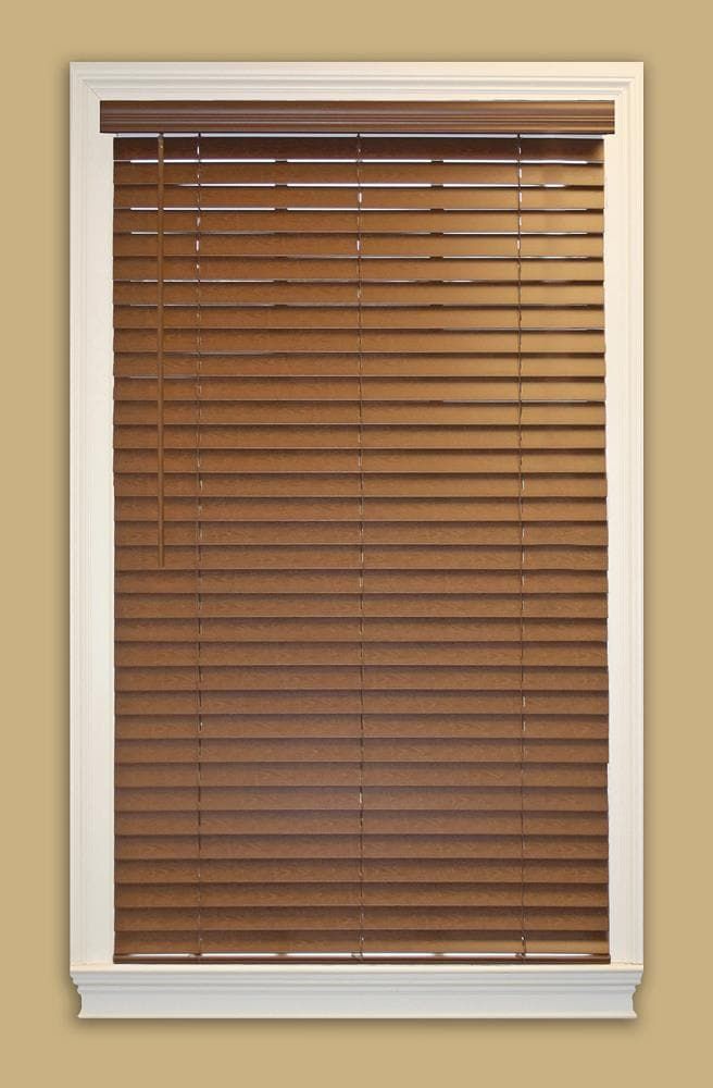 a window with brown blinds and white trim