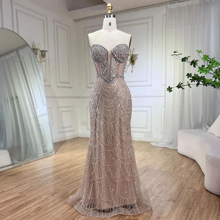 Nude Strapless Mermaid Luxury Evening Dress - Beaded Arabic Design for Women's Wedding Party Elegant Champagne Gown With Mermaid Hem, Elegant Evening Wedding Dress With Mermaid Hem, Glamorous Wedding Mermaid Dress With Sweep Train, Champagne Fitted Mermaid Wedding Dress, Champagne Mermaid Wedding Dress Fitted, Glamorous Wedding Mermaid Dress, Champagne Embellished Mermaid Dress For Prom Season, Champagne Mermaid Dress With Fitted Bodice, Embellished Champagne Mermaid Dress For Prom