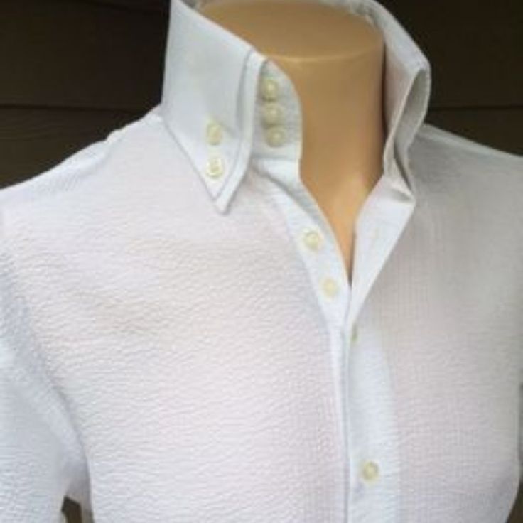 Morcouture White Seersucker Short Sleeve Shirt. 3 Button Collar, Double Exposed Button Down Collar. See Alternate Color Pics(Custom Only-4weeks). White Color Is In Stock. Shirt Is Full/Regular Cut. Fitted Shirt With Buttons For Daywear, Classic White Tops With Covered Buttons, Fitted White Top With Button Cuffs, Semi-formal Tops With Buttons And Collar, Fitted Tops With Covered Buttons And Fold Down Collar, Collar Top With Buttons For Semi-formal Occasions, White Button-up Shirt With Covered Buttons, Fitted White Dress Shirt With Buttons, White Fitted Dress Shirt With Buttons