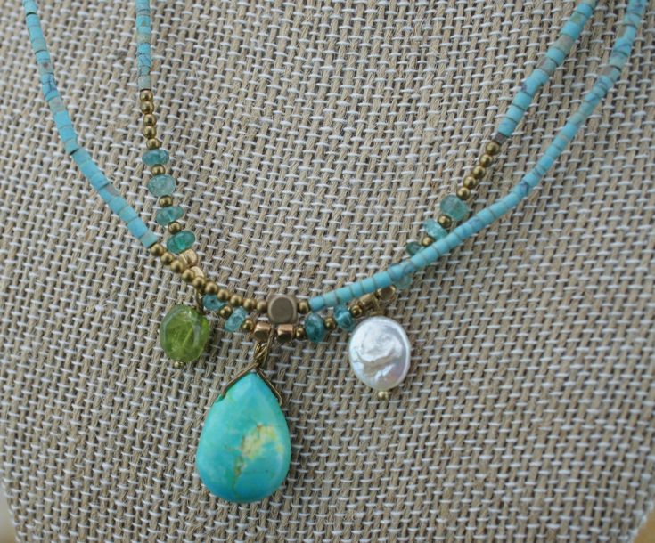 This is the perfect option for those who like cool, unique jewelry, and the luxury, shine of green, white, silver, gold. This set is well made, cute and/or elegant in design, and very desirable. ♥The necklace has 2 strands. ♥The necklaces are choker. ♥The necklace is decorated with seed beads, turquoise, mother pearls. ♥See photo. ♥ Age/Era: Circa before the 2001s. ♥The necklace is about 17'' long. Everyone interested in the jewelry should remember that he or she must like their jewelry- not jus Double Strand Turquoise Necklace With Gemstone Beads As Gift, Double Strand Turquoise Gemstone Beads Necklace Gift, Handmade Double Strand Turquoise Necklace For Gift, Handmade Turquoise Double Strand Jewelry, Turquoise Double Strand Jewelry With Colorful Beads, Handmade Double Strand Turquoise Jewelry, Double Strand Turquoise Jewelry With Colorful Beads, Turquoise Double Strand Jewelry Gift, Handmade Green Turquoise Dangle Necklace