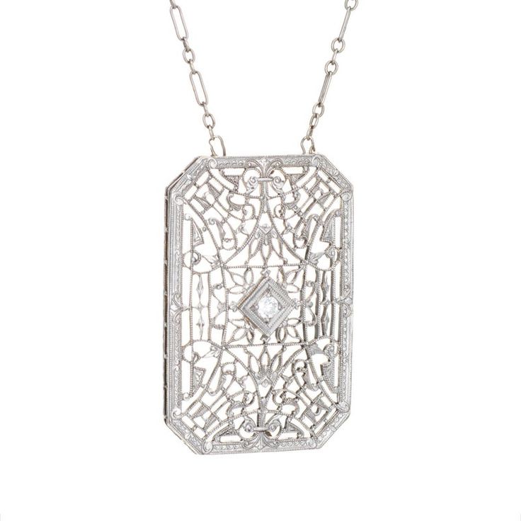 Finely detailed vintage Art Deco drop necklace (circa 1920s to 1930s), crafted in 14 karat white gold.   The drop is set with an estimated 0.04 carat Old European cut diamond (estimated at H-I colour and SI1 clarity).    The die-struck necklace features intricate and lacy filigree detail. The chain is comprised of longer bar links attached to smaller round links. The necklace measures 17 inches and sits nicely at the nape of the neck. The filigree necklace was very popular during the era and is Antique White Gold Diamond Necklace With Accents, Antique White Gold Diamond Necklace With Single Cut Diamonds, Formal Art Deco Necklaces With Single Cut Diamonds, Antique White Gold Diamond Necklace, Vintage Single Cut Diamond White Necklace, Antique White Gold Diamond Pendant Necklace, Vintage Diamond White Necklace With Single Cut Diamonds, Wedding Rose Cut Diamond Platinum Necklace, Wedding Platinum Necklace With Rose Cut Diamonds