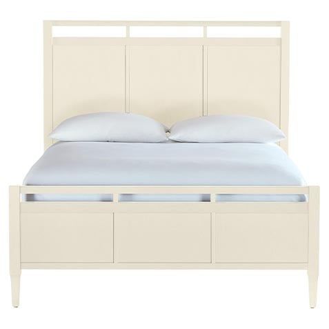 a white bed with two drawers underneath the headboard and pillows on top of it