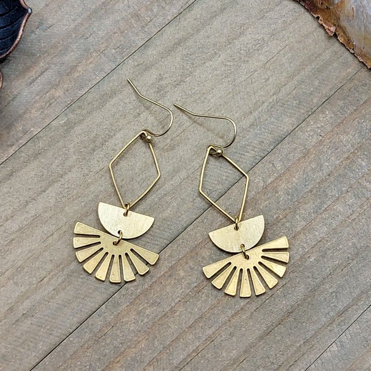 Take your style to geometric heights with these hip and happening gold textured brass dangles. With their textured texture and eye-catching shape, they'll be the perfect accessory to add a little extra shimmer to your look! Textured Brass geometric shapes Brass ear hooks Drop Length is 2.25" Created in studio -Wilmington, NC Gold Geometric Metal Jewelry, Geometric Metal Earrings With Ear Wire, Gold Geometric Brass Jewelry, Textured Metal Drop Earrings, Wilmington Nc, Ear Hook, Gold Texture, Geometric Shapes, Jewelry Inspiration