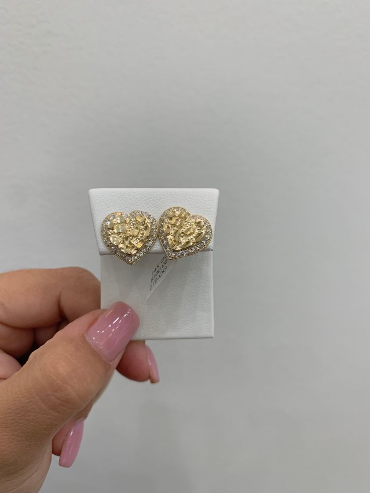 Nugget heart earrings with cubic zirconias, 14k gold, perfect push brooch, easy and resistant, you can wear them daily and they will not stain your skin or change color because it is 14k solid gold, if you have any questions send a message , item sold by piece, weight undetermined. Gold Heart-shaped Cubic Zirconia Earrings, 14k Gold Diamond Cut Heart Earrings, Gold Plated Heart Cut Earrings For Anniversary, Luxury Diamond Heart Earrings For Gift, Gold Cubic Zirconia Earrings With Heart Charm, Gold Heart Earrings With Cubic Zirconia, Gold Double Heart Cubic Zirconia Earrings, Gold Cubic Zirconia Pierced Heart Earrings, Heart-shaped Gold Cubic Zirconia Earrings