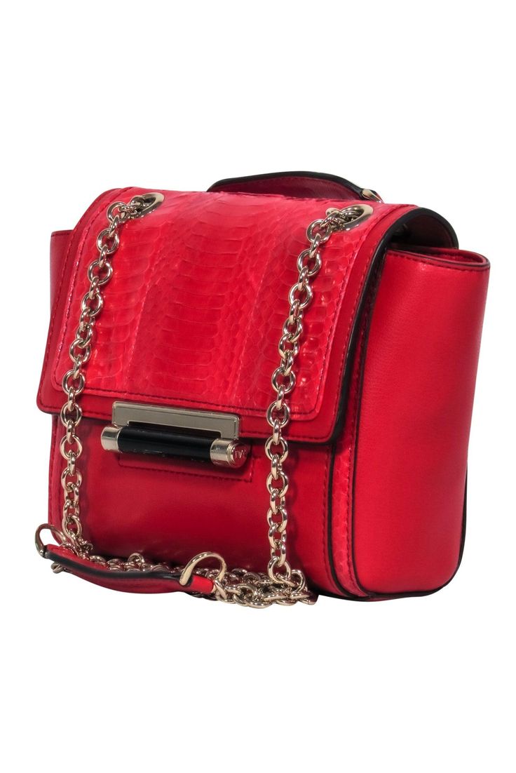 Get some red hot style with any outfit when you carry this textured treasure from Diane von Furstenberg! Perfect for wearing with any sparkling cocktail dress or even your favorite blouse and jeans combo for a night out, this is the perfect subtle statement bag for pop of color. Smooth leather with snakeskin accents Flap closure with snap button Gold-toned chain strap Strap can be shoulder bag length or crossbody length Two interior pockets Dustbag included Width 7.5" Height 6.5" Depth 1.75" Str Leather Evening Bag With Chain Strap For Party, Glamorous Leather Evening Shoulder Bag, Glamorous Evening Leather Shoulder Bag, Elegant Leather Shoulder Bag For Night Out, Formal Red Bag With Magnetic Closure, Red Evening Bag With Detachable Strap, Red Leather Evening Bag For Party, Red Shoulder Evening Bag, Red Party Shoulder Bag With Detachable Strap