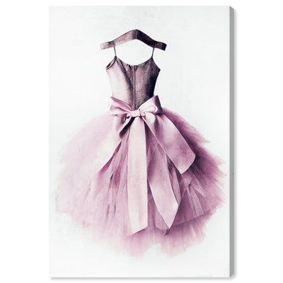 a pink dress with a bow on the front and bottom, hanging on a white wall