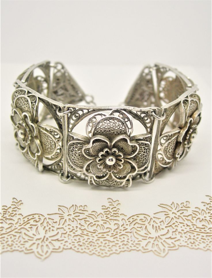 An exquisite silver bracelet created with fine quality filigree to celebrate life's special moments. Sterling silver filigree bracelet large hand made vintage, antique, authentic  7 1/4 inches 18.5 cm (the length could be extended) A fine gift for life Intricate Silver Sterling Bracelets, Sterling Silver Bracelet With Intricate Design Adjustable, Silver Sterling Silver Bracelet With Intricate Design, Sterling Silver Bracelets With Intricate Design, Vintage Sterling Silver Bracelets With Intricate Design, Elegant Sterling Silver Filigree Bracelet For Wedding, Ornate Sterling Silver Bracelet With Oxidized Finish As Gift, Traditional Sterling Silver Bracelet With Intricate Design For Anniversary, Vintage Sterling Silver Bracelet For Wedding