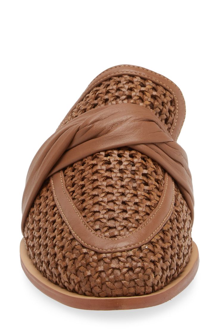 A twisted instep strap and woven upper add textural intrigue to loafer-inspired mule fashioned with a slender moc toe. Leather upper, lining and sole Imported Hispanic & Latinx Owned/Founded Chic Woven Leather Mules For Spring, Chic Spring Mules With Woven Leather, Chic Woven Leather Mules With Flat Heel, Chic Woven Leather Flat Heel Mules, Chic Woven Leather Flat Mules, Chic Flat Heel Woven Leather Mules, Leather Slip-ons With Woven Sole For Spring, Spring Leather Woven Mules, Formal Spring Mules With Woven Sole