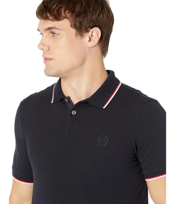 Elevate your look by wearing the Armani Exchange® Slim Fit Pique Logo Polo T-shirt..Slim fit..Pointy collars..Two-button placket..Short sleeves..Branding on front..Straight hem..100% cotton..Machine wash, dry flat..Imported..Product measurements were taken using size MD. Please note that measurements may vary by size..Measurements: Length: 28 in Classic Short Sleeve Polo Shirt With Striped Collar, Navy Short Sleeve Polo Shirt With Ribbed Collar, Black Polo Shirt With Striped Collar, Summer Polo Shirt With Contrast Collar And Short Sleeves, Navy Cotton Polo Shirt With Short Sleeves, Navy Cotton Short Sleeve Polo Shirt, Navy Short Sleeve Cotton Polo Shirt, Navy Slim Fit Collared Top, Navy Polo Shirt With Contrast Collar, Short Sleeve