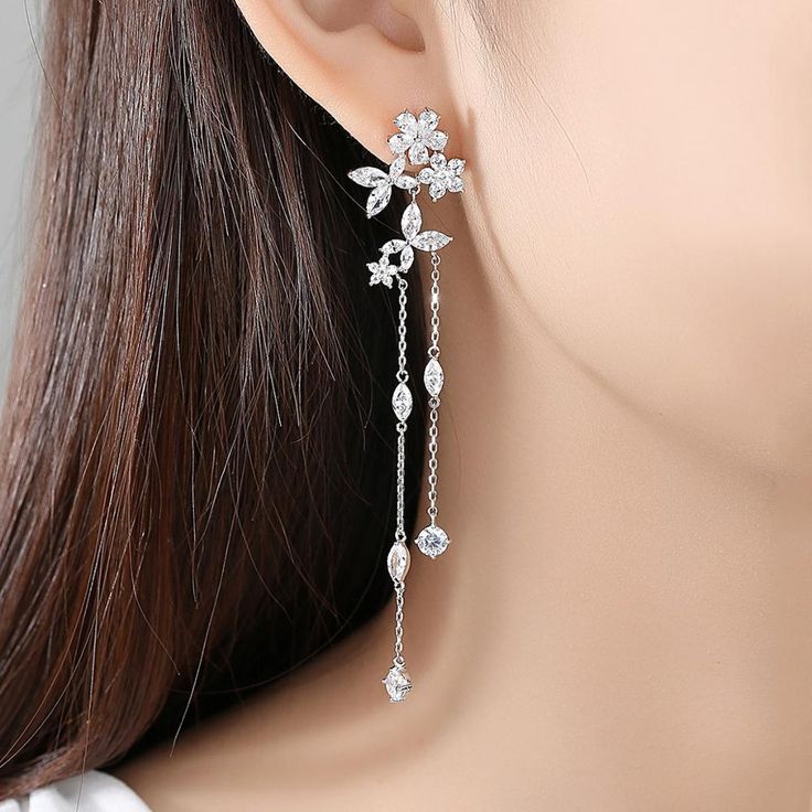 Material: Copper, Rhodium Plated, Cubic ZirconiaSize: 8.6cm by 1.8cmWeight: 6.2gDesign: Crystal Flowers and Leaves on a Chain Drop Dangle Statement Earring Color: White, Silver Silver Prom Jewelry, Formal Jewelry, Crystal Earrings Wedding, Crystal Bridal Earrings, Prom Earrings, Prom Jewelry, Fancy Jewelry, Dangly Earrings, Girly Jewelry