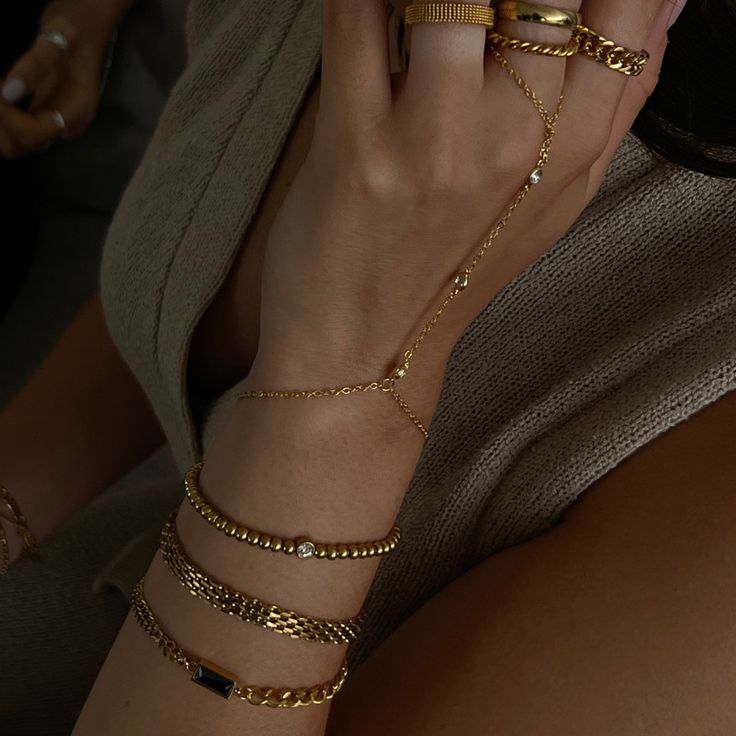 Elevate your arm party with this Luxe bracelet! Featuring a mesh chain and chunky design, it'll make a sizzling statement wherever you go! Slip it on to instantly upgrade your outfit and stand out from the crowd. Shine brighter than the rest with this bold bracelet! At Home Bracelets, Wrist Accessories Women, Black Outfit With Gold Jewelry, Bracelet Combo Ideas, Chain Bracelet Gold For Women, Bracelets On Both Wrists, Hoop Bracelet, Bracelet Stack Gold, Arm Rings