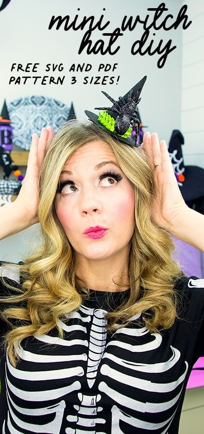 a woman with her hands on her head wearing a skeleton top and black striped shirt