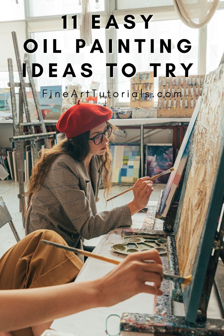 a woman sitting in front of an easel painting