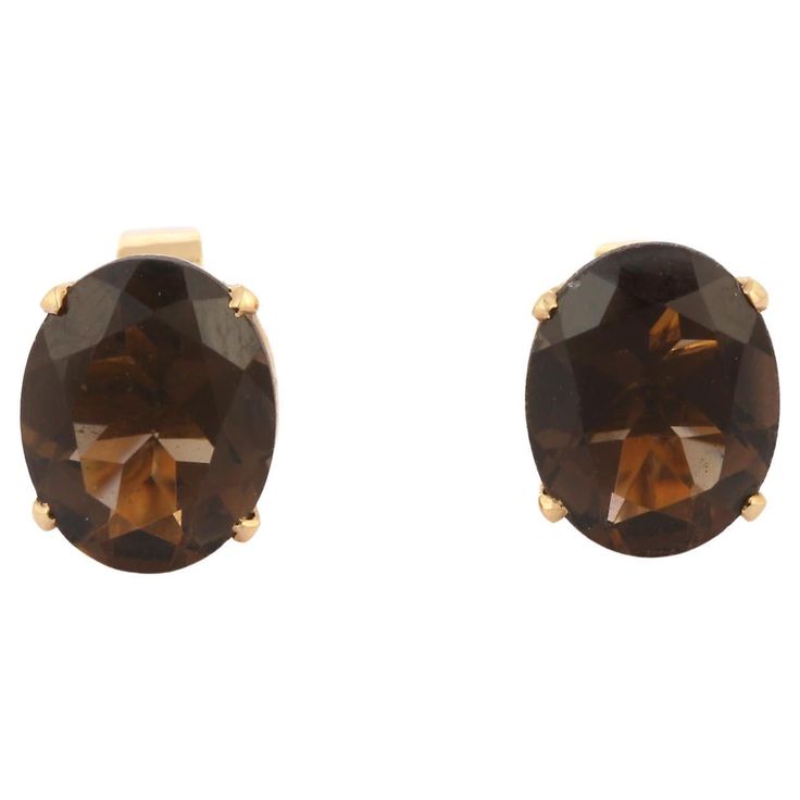 Studs create a subtle beauty while showcasing the colors of the natural precious gemstones and illuminating diamonds making a statement. Oval cut smoky quartz studs in 18K gold. Embrace your look with these stunning pair of earrings suitable for any occasion to complete your outfit. PRODUCT DETAILS :- > Material - 18K Solid Yellow Gold > Gemstone - Smoky quartz > Gemstone Weight - 2.18 ct > Gemstone pcs - 2 > Gemstone shape - Oval > Gemstone size - 10 x 8 mm > Gross Weight - 2.91 Grm > Setting - Classic Oval Earrings With Gemstone Accents, Formal Oval Faceted Earrings, Elegant Oval Brown Earrings, Long Bar Earrings, American Art Deco, Ruby Earrings Studs, Chevron Earrings, Subtle Beauty, Gold Diamond Earrings Studs