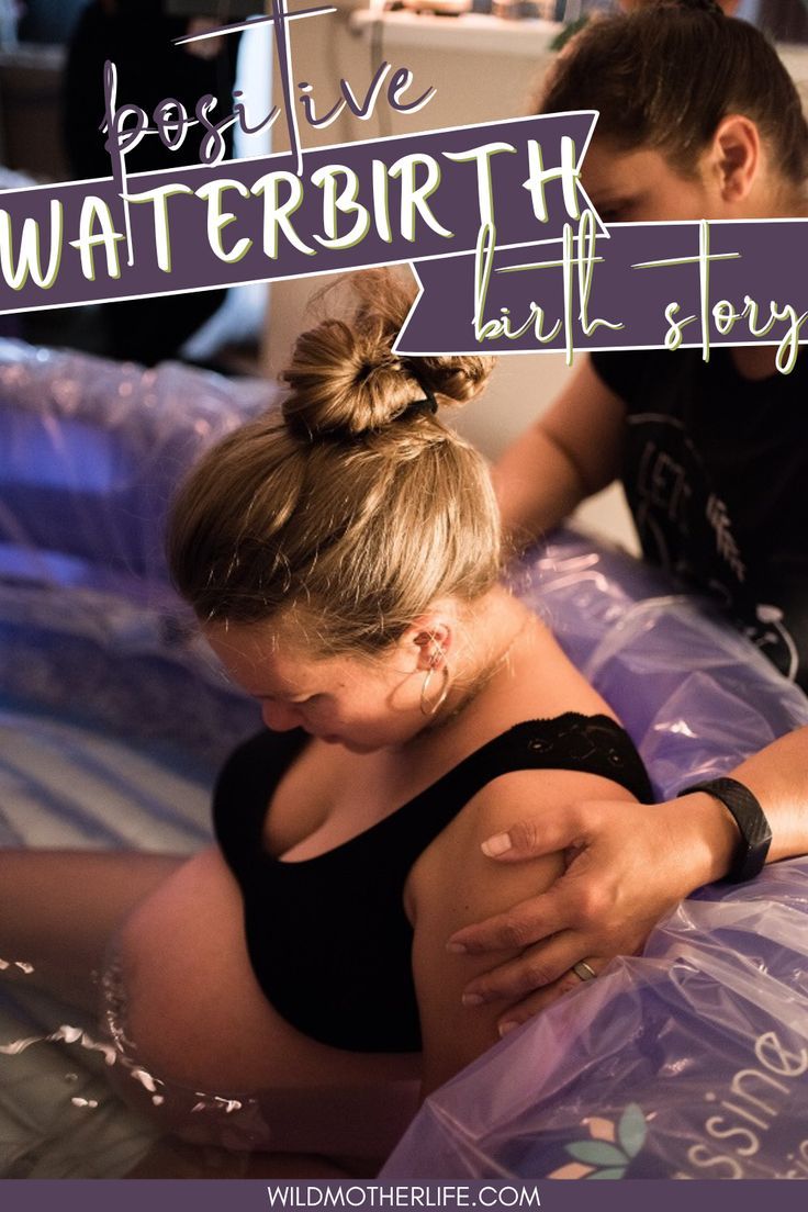 a pregnant woman laying on top of an inflatable bed next to a man