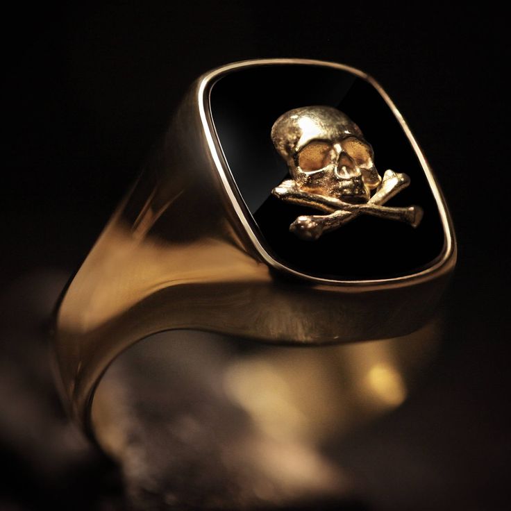 "Considered the \"gentleman's ring\", there doesn't seem to be a more perfect piece of jewelry to proudly wear than the signet ring. Our 18kt. gold signet ring is very unique with a straight oval deep black onyx stone set within. On top of the onyx sits a 18kt. golden skull and crossbones design. Shipping&Processing Since all our items are individually handmade, we need about 4 weeks (at most) to make your item. Shipping is on us, we use DHL express so it will only take 3 days on average. Pa Classic Formal Skull Ring With Polished Finish, Timeless Tarnish Resistant Signet Ring For Formal Occasions, Gold Signet Ring With Classic Design For Formal Occasions, Luxury Formal Signet Ring Stamped 14k, Luxury 14k Stamped Signet Ring For Formal Occasions, Luxury Polished Skull Ring As Gift, Luxury Skull Ring With Polished Finish As Gift, Luxury Signet Ring With Classic Design, Gold 14k Stamped Signet Ring For Formal Occasions