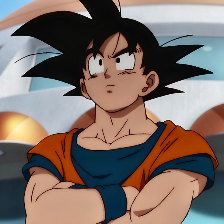 a young gohan with his arms crossed in front of him, looking at the camera