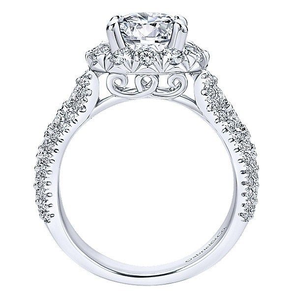 a white gold engagement ring with an intricate halo setting