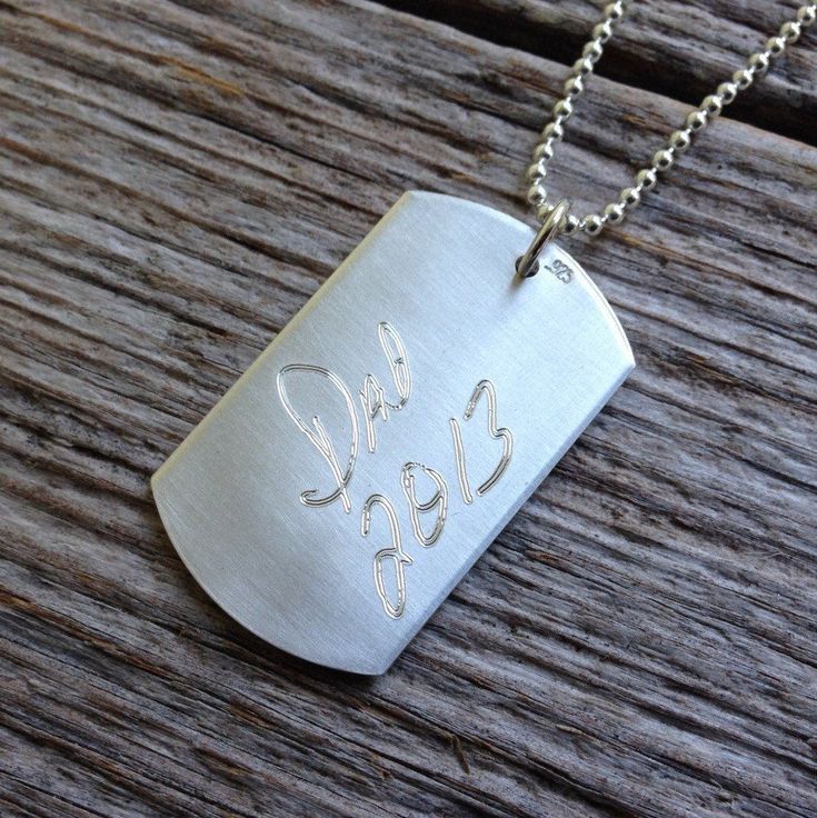 "This signature dog tag necklace is an excellent gift because your actual handwriting jewelry will be cherished for many years. Engrave the signature of your loved one on this sterling silver dog tag necklace. Just send a clear photo (free from shadows, stray marks or folds) and have it engraved into sterling silver. Choose to have one or both sides engraved with the words of someone you love. This pendant measures 1.25 inches x 3/4\". Other sizes or shapes are available as well. Just send me a Father's Day Anniversary Dog Tag Necklace, Silver Dog Tag Jewelry For Mother's Day, Personalized Sterling Silver Dog Tag Jewelry, Personalized Dog Tag Jewelry For Memorial, Personalized Memorial Dog Tag Jewelry, Sterling Silver Dog Tag Jewelry With Engraving Option, Personalized Hand Stamped Dog Tag Jewelry, Father's Day Sterling Silver Dog Tag Jewelry, Father's Day Hand Stamped Dog Tag Necklaces