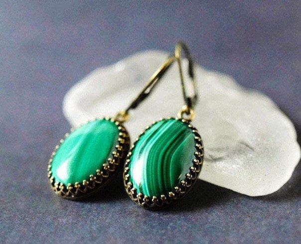 "Malachite Earrings - Cabochon Emerald Green Earrings - Antique Gold Bezel - Gemstone Jewelry Custom Gift .. .. .. Gorgeous artisan handcrafted natural stone malachite earrings feature brilliantly polished cabochon malachite gemstones. Rich lush forest green, emerald, and light green hues display unique striped patterns. Each stone is extremely beautiful high quality Grade B. I carefully hand set each gemstone in high quality open back crown trim edged styled antiqued gold brass plated bezels ma Agate Drop Earrings As A Gift, Agate Drop Earrings Gift, Agate Drop Earrings For Gift, Green Onyx Jewelry With Natural Stones For Jewelry Making, Brass Cabochon Jewelry For Jewelry Making, Green Brass Jewelry For Gifts, Green Brass Jewelry As Gift, Green Brass Jewelry For Gift, Green Brass Jewelry Gift