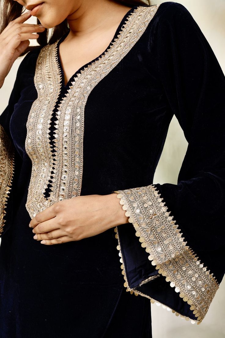 Amp up your look with the grace and simplicity of this New Navy blue velvet suit with overall embroidery. Having a lightweight dupatta and an easy-to-style appeal, this lehnga is an excellent pick for days when you are looking for sheer perfection.StyleNavy blue velvet suitEmbroidered DetailingMatching DupattaChiffon fabricSpecificationsModel height - 5'7"Model wearing - S Velvet Suit Outfit Women, Velvet Suit Designs Pakistani Party Wear, Black Pakistani Suit Party Wear, Pakistani Velvet Suits Party Wear, Velvet Suits Women Indian Party Wear, Velvet Suit Designs Pakistani, Navy Blue Velvet Suit, Velvet Suits Women Indian, Suit Neck Designs Indian