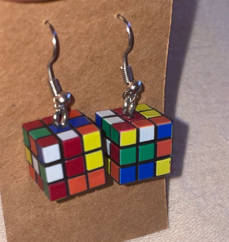 Mini rubix cube-inspired earrings. A one-of-kind gift for the classic puzzle lover! Retro Hypoallergenic Earrings For Gift, Retro Rectangular Earrings For Gift, Multicolor Square Jewelry Gift, Multicolor Square Jewelry For Gifts, Nickel-free Multicolor Rectangular Earrings, Silver Cube Earrings For Gifts, Gift Square Pendant Earrings For Pierced Ears, Gift Earrings With Square Pendant For Pierced Ears, Multicolor Rectangular Earrings As A Gift